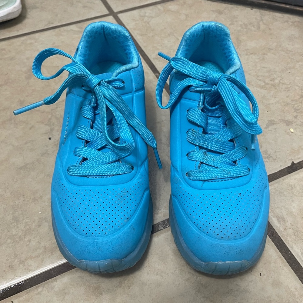 Girl sketchers sneakers.